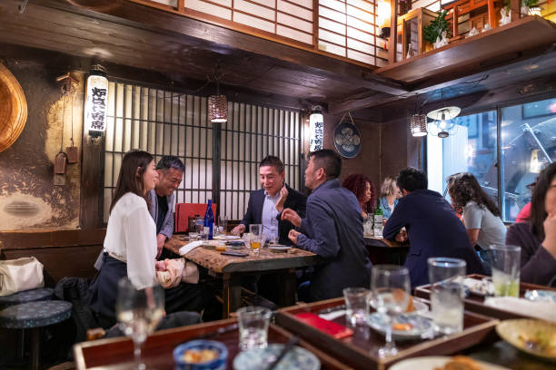 istock People Enjoying a Dinner and Drinks at a Restaurant in Tokyo 1172360932