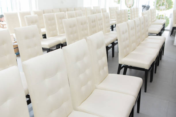 istock White chairs arranged in a seminar room 1172361977