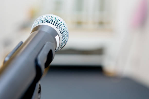 istock microphone in the seminar room on blurred background 1172361994