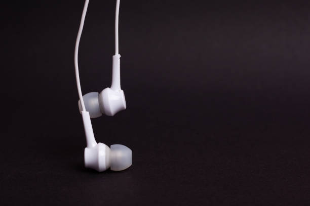istock White headphones on a dark background  with copy space 1172362692