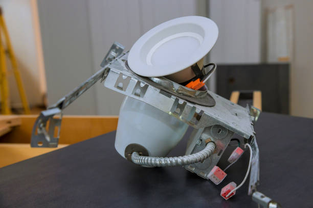 istock Installing electrical light in the ceiling replacing repair works in the flat. 1172366363