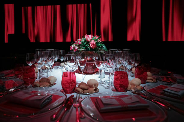Red table set for Christmas party or Grand Gala with soft lights and romantic atmosphere