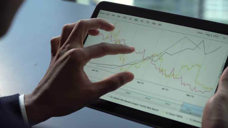 Businessman Hands touching on digital tablet for analyze graph