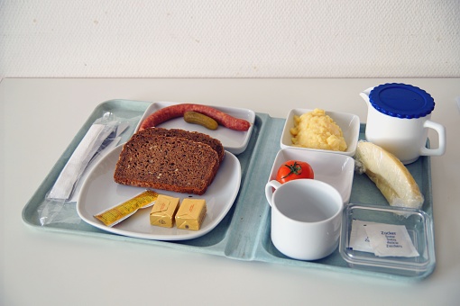 dinner plate of Food on a Tablet in a hospital.