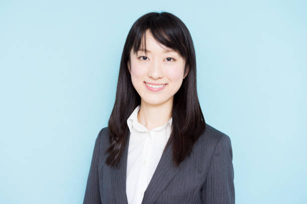 istock Young business woman against light blue background 1172393957
