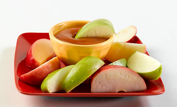 Caramel Apples  dipping stock pictures, royalty-free photos & images