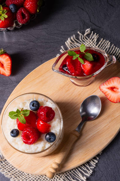 istock delicious milk rice with different berries and red fruit jelly 1172394296