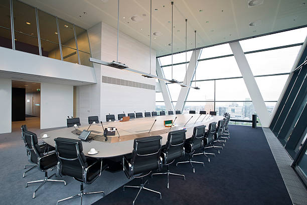 Luxurious board room with meeting table and chairs stock photo