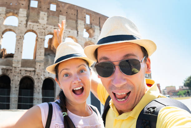 istock Couple Taking Selfie In Front Of Colosseum 1172394526
