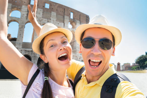 istock Couple Taking Selfie In Front Of Colosseum 1172394534