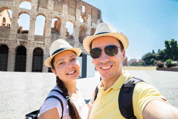istock Couple Taking Selfie In Front Of Colosseum 1172394536