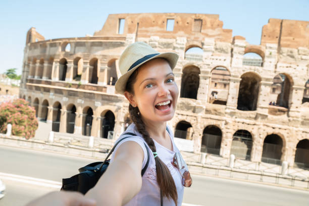 istock Happy Woman Pulling Her Boyfriend While Walking To Colosseum 1172394540