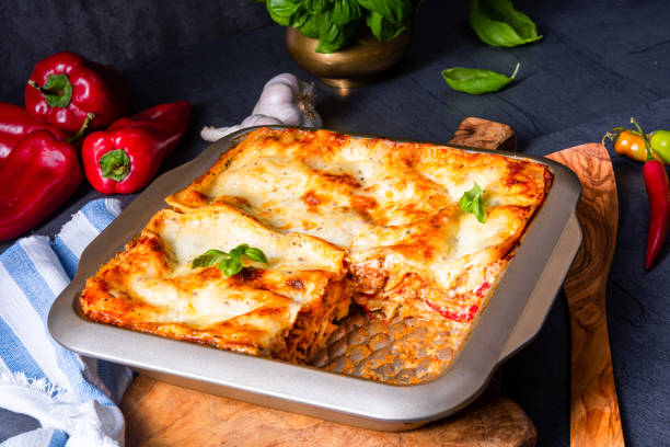 istock rustic spicy lasagne with basil on the tin. 1172395491
