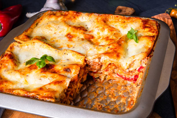 istock rustic spicy lasagne with basil on the tin. 1172395519