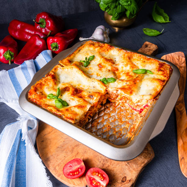 istock rustic spicy lasagne with basil on the tin. 1172395621