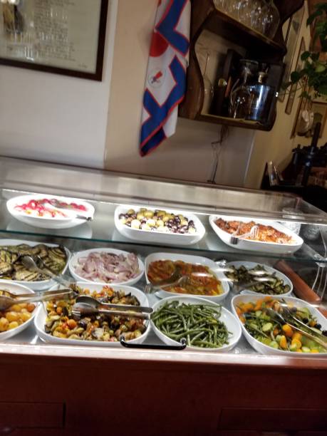 Menu dishes ready in the case for lunch in a restaurant in Florence, Italy