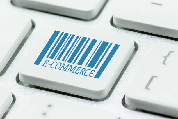 ecommerce and retail sale concept : unusable model barcode with a word e-commerce on computer button / laptop keyboard, depict buyers or customers order or buy things from retailer site using internet - unusable imagens e fotografias de stock