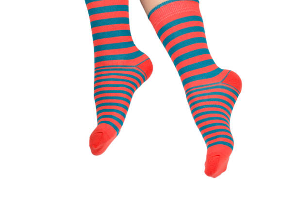 istock Woman in orange socks isolated on white background. Top view. 1172407549