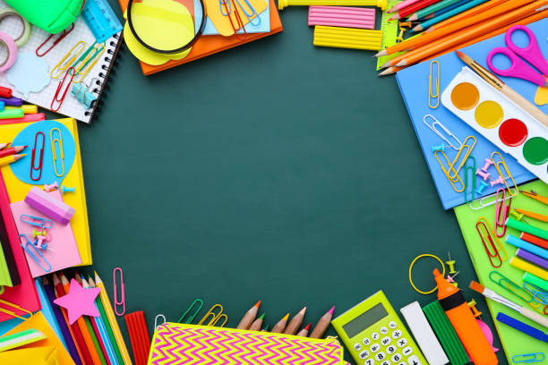istock Different school supplies on green chalkboard 1172408572