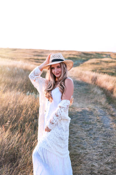 istock Beautiful woman enjoying nature outdoors at sunset. 1172409185