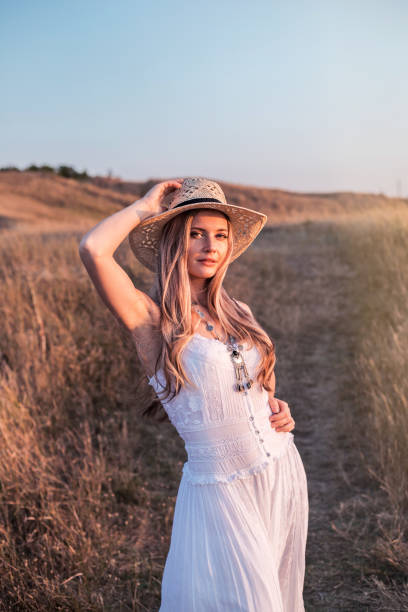 istock Beautiful woman enjoying nature outdoors at sunset. 1172409189