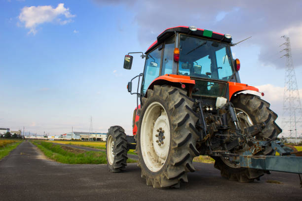 istock Japanese landscape with tractor and field. 1172409802