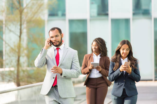 istock Serious Latin businessman speaking on mobile phone 1172411021