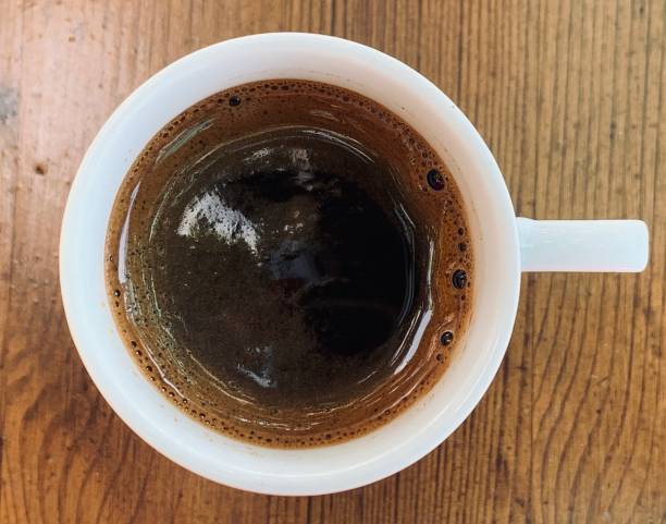 istock Cup of black coffee espresso on wooden table 1172411782