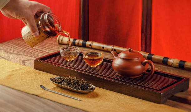 istock tea table with instruments teapots cups pancake and tea Shen Puer 1172412652