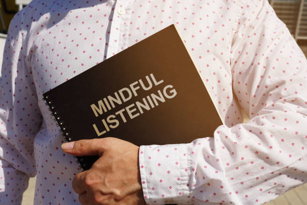 istock Text sign showing hand writing words Mindful Listening 1172413018