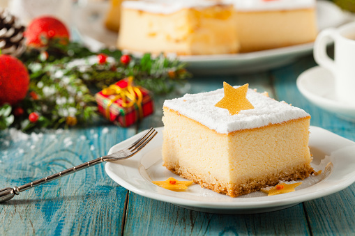 Delicious, traditional cheesecake. Christmas decoration. Front view.