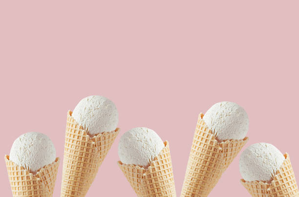 istock Classic white creamy ice cream waffle cones as decorative frame on pink background, mock up, copy space. 1172413115