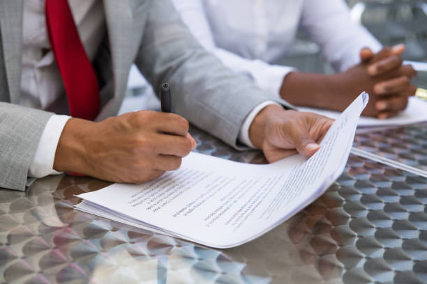 istock Business leader reading and checking agreement text 1172413460