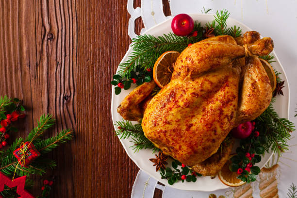 istock Roasted whole chicken with Christmas decoration. 1172413604