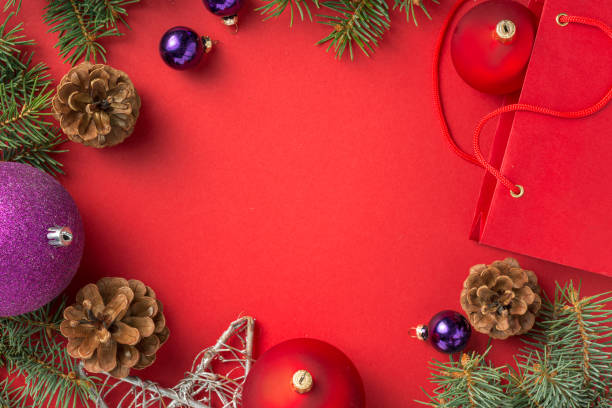 istock Frame of christmas decoration on red background top view 1172417246