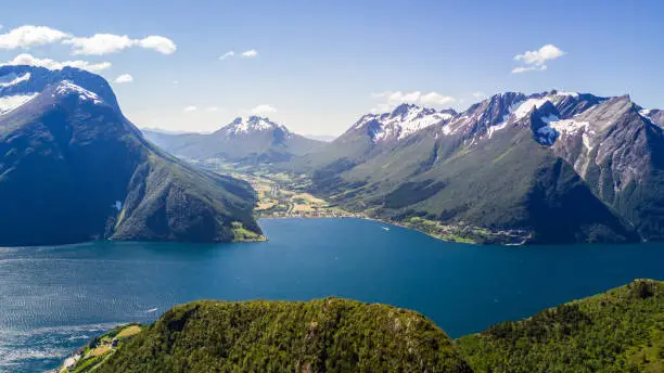 Aerial view on Geiranger town, harbor and fjord in More og Romsdal county in Norway famous for his beautiful boattrip through the fjord.
