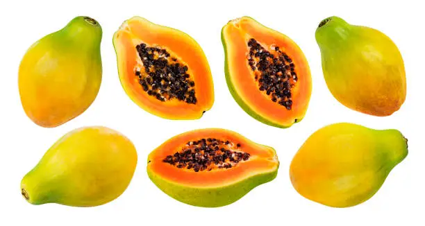 Whole and half of ripe papaya fruit isolated on white background with clipping path, collection