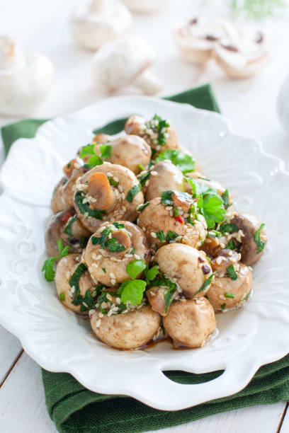istock Marinated champignons in Korean with spices, herbs and sesame, selective focus 1172422479