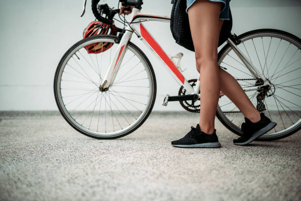 istock Close up woman legs and bicycle 1172422765