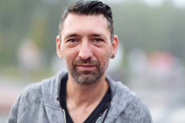 midadult man portrait in rain