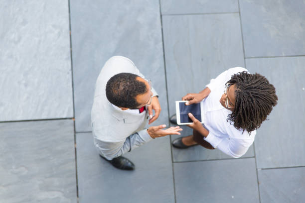 istock Two professionals meeting near office 1172424539