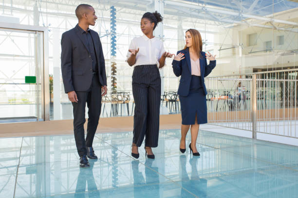 istock Diverse business partners going through office hallway 1172426154