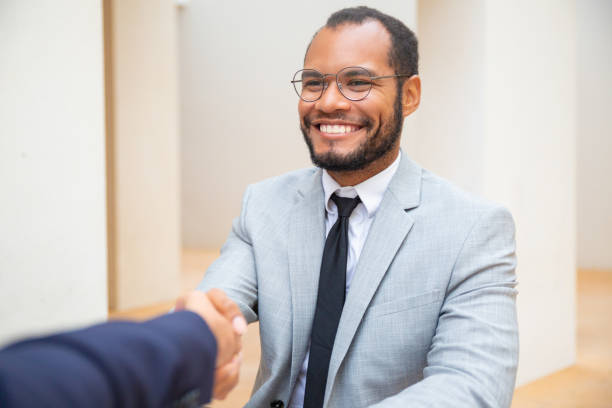 istock Cheerful business man greeting colleague 1172426792