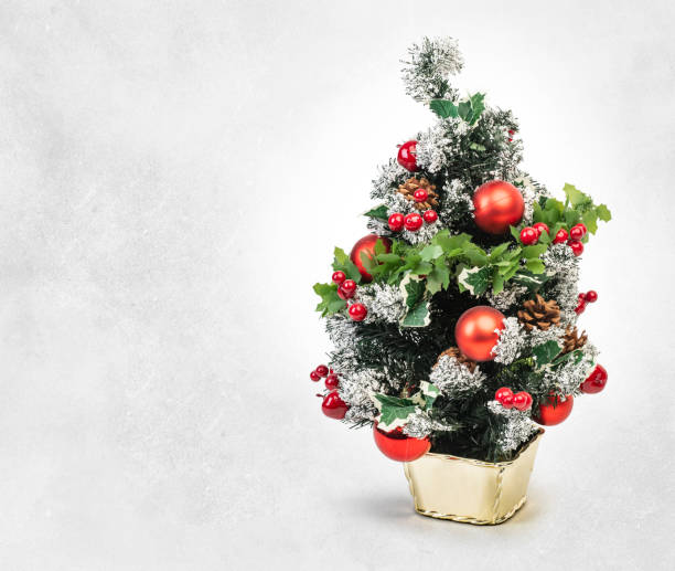 istock decorated mini christmas tree isolated, Clipping path included 1172426922