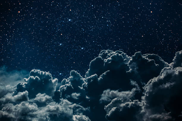 istock backgrounds night sky with stars and moon and clouds. 1172427883