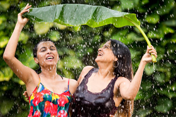 istock Tho women enjoying rain 1172431843