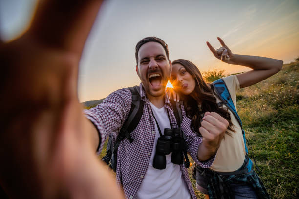 istock Happy couple taking selfie in sunset 1172432319