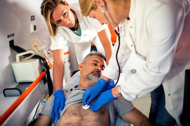 istock Doctor and paramedics helping mature man 1172432690