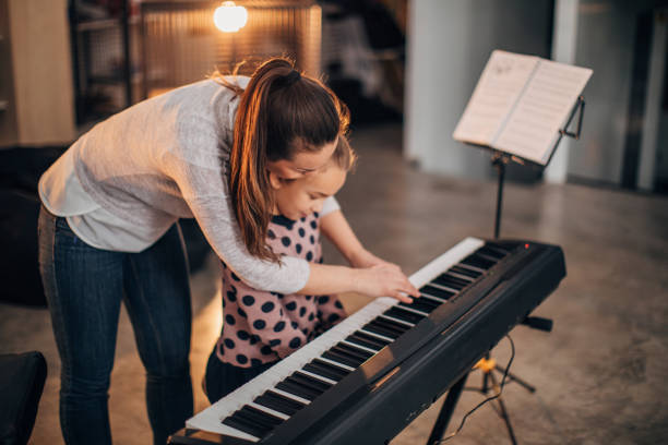 istock Young girl on piano class 1172433507