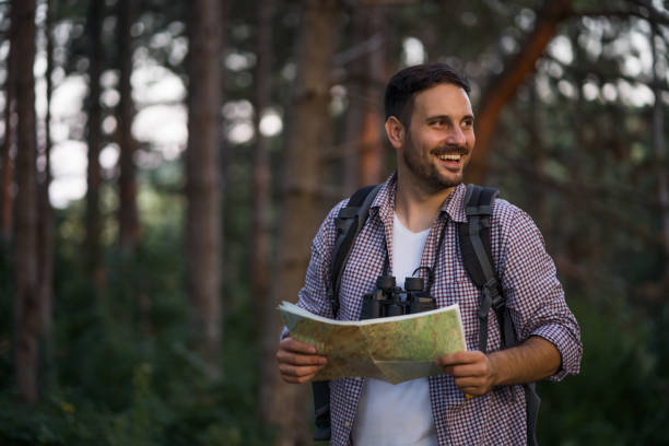 istock Young man hiking in forest 1172433688